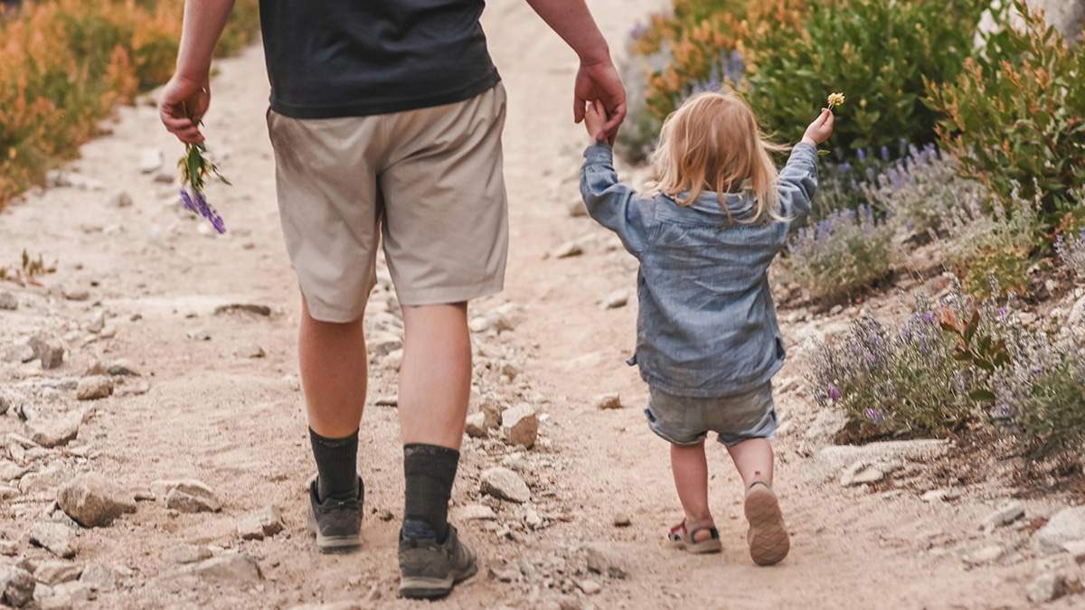 Father and child walking together