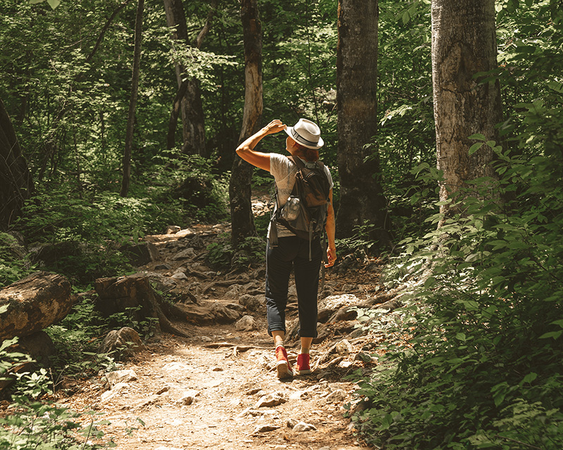 Woman in a forest searching for inner child healing
